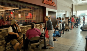 Powerful customer experience example: the line for a Hallmark Christmas ornament event in August.