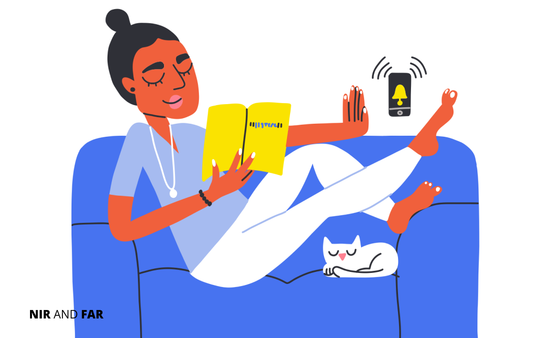Woman reads a book on her couch with her cat while ignoring ringing cell phone