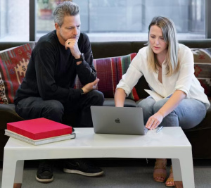 Man meeting with woman to sync schedules