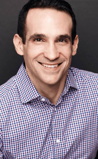 Headshot of Nir Eyal in button-down checkered shirt